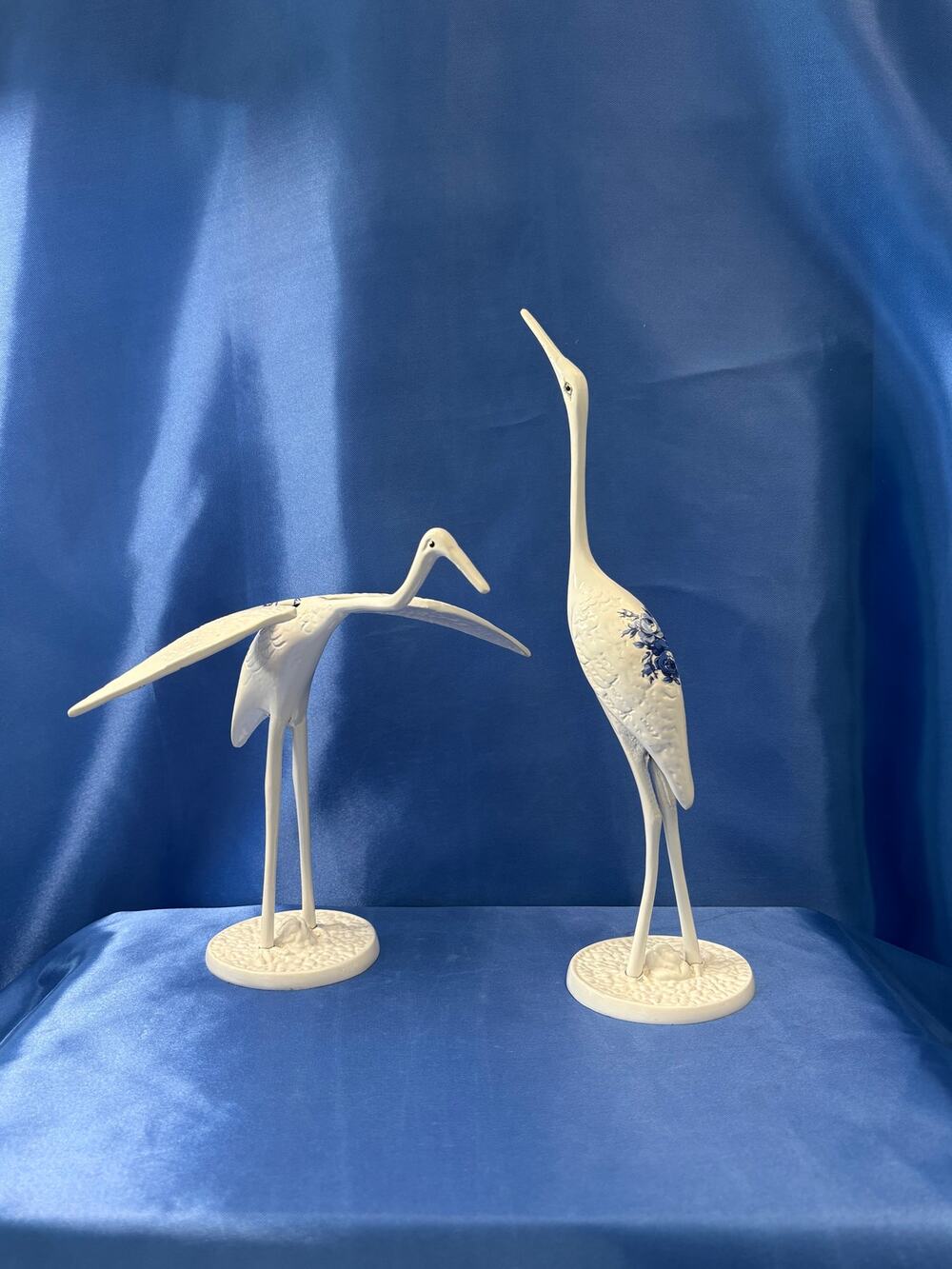 Pair of White Enamel Metal Cranes Accented with Blue Flower Design